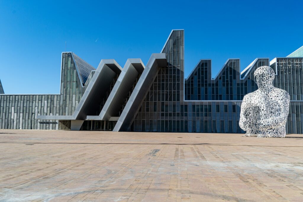 a large building with a statue in front of it