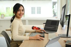 Image of female video editor working with footage and post production montage.
