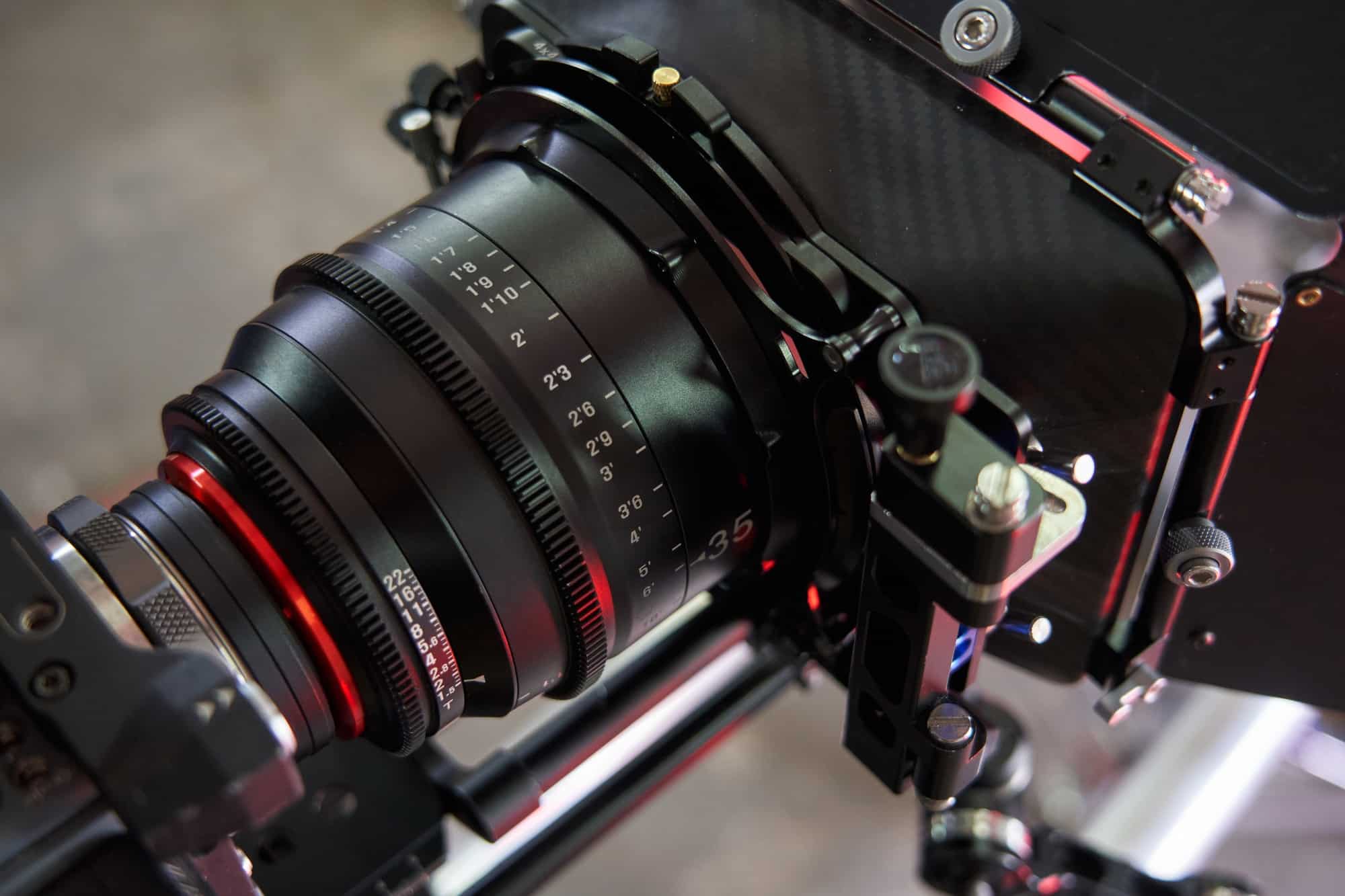 professional cine lens mounted on professional movie camera with compendium